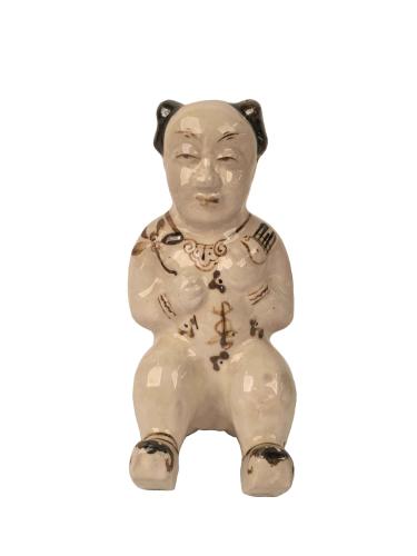 CHINESE CERAMIC FIGURE OF A SEATED INFANT by 