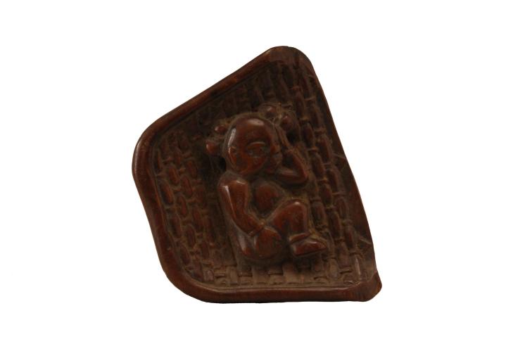 CHINESE TOGGLE SLEEPING CHILD IN WINNOWING BASKET by 